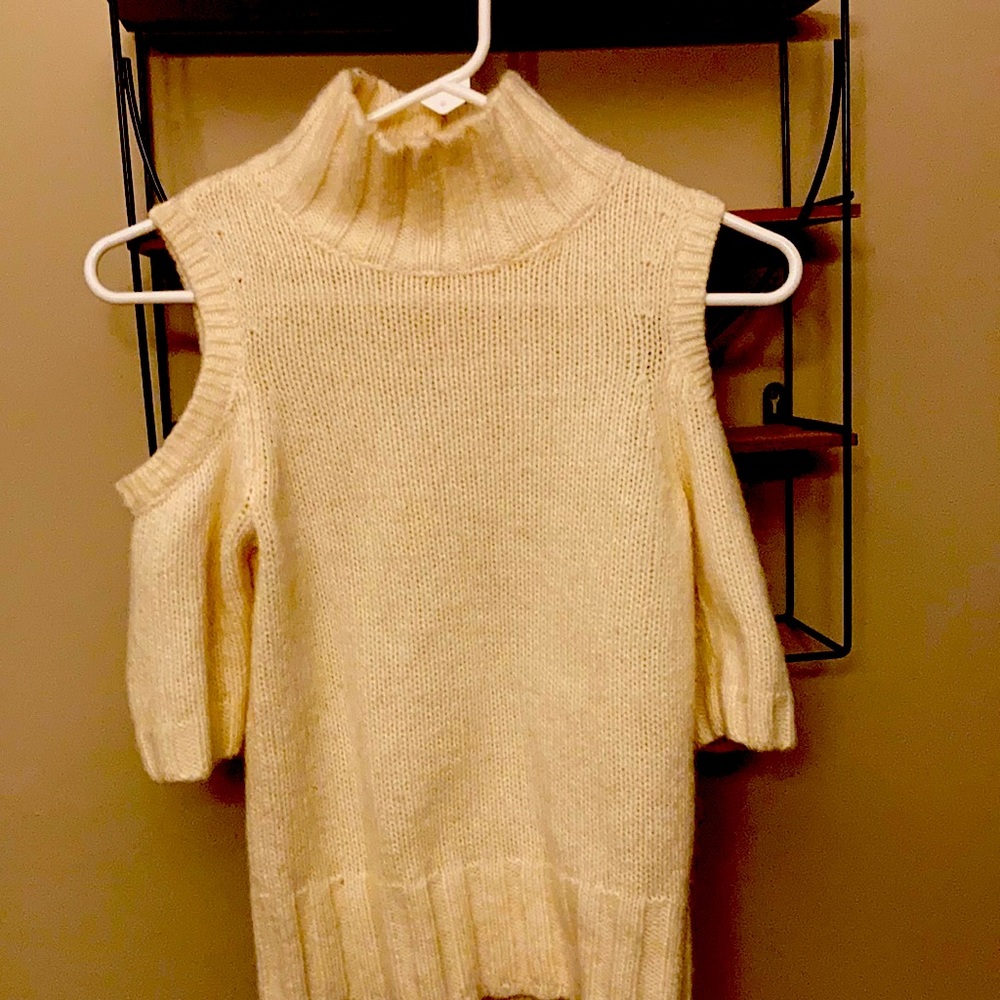 Super sexy express cut out shoulder cream turtle neck .